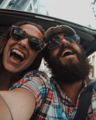 A selfie of a couple inside a car