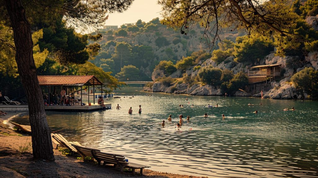 Serene scene at Lake Vouliagmeni near Athens, Greece with people swimming and enjoying the natural hot springs.